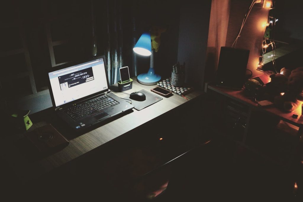 A desk in a dark room.